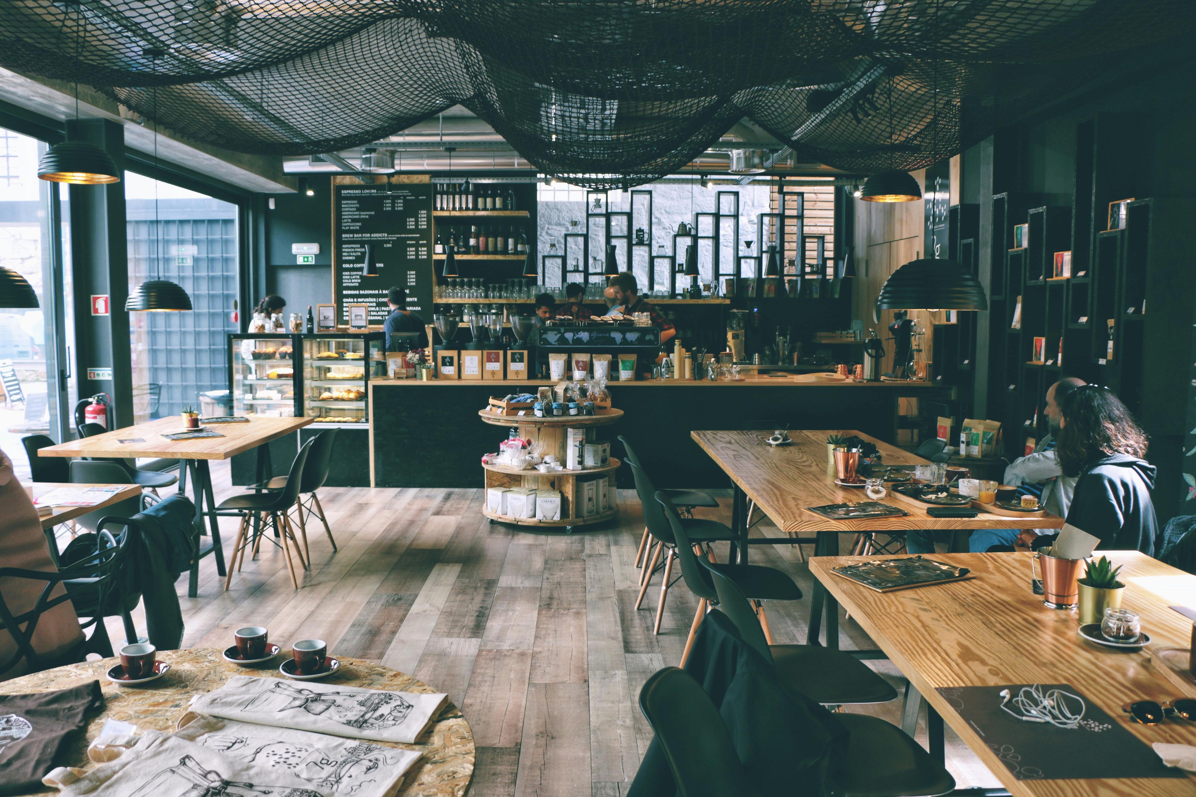 Minimalist workspace layout featuring coffee and laptops
